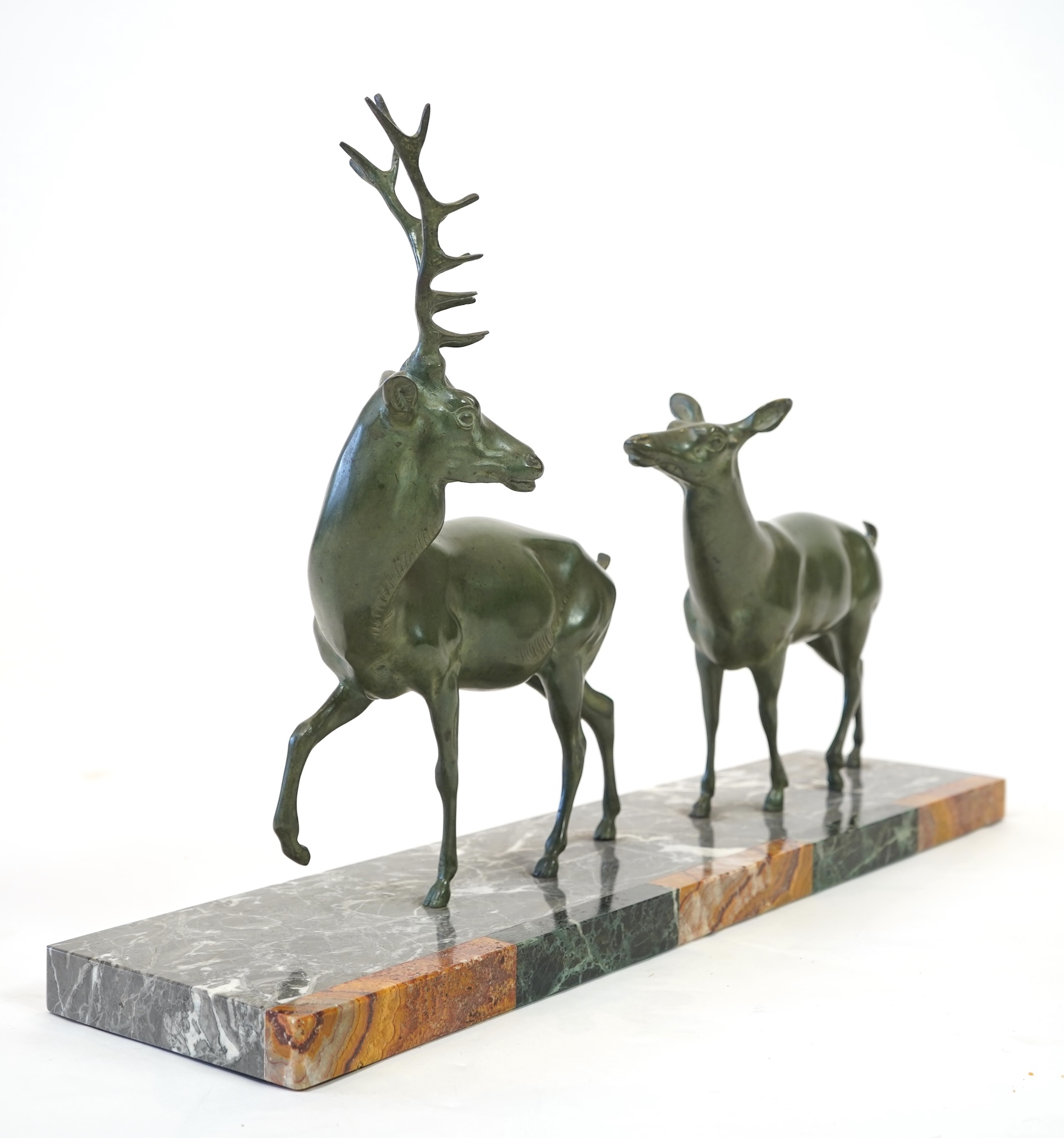 Manner of Louis-Albert Carvin, French 1875-1951, An Art Deco bronze group of a stag and doe